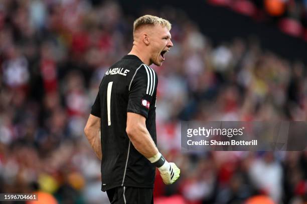 Aaron Ramsdale of Arsenal reacts after saving a penalty taken by Rodri of Manchester City during The FA Community Shield match between Manchester...