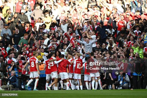 The Arsenal players celebrate after winning the penalty shoot out during The FA Community Shield match between Manchester City against Arsenal at...