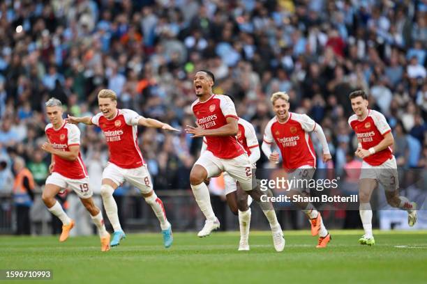 William Saliba of Arsenal and teammates celebrate after Fabio Vieira of Arsenal scores the team's fourth penalty in the penalty shoot out during The...