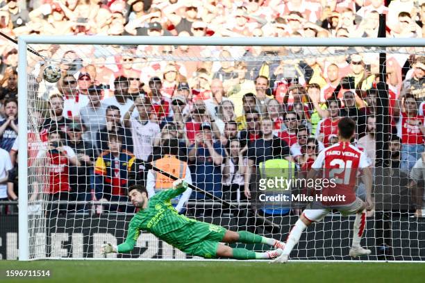 Fabio Vieira of Arsenal scores the sides winning penalty in the penalty shoot out during The FA Community Shield match between Manchester City...