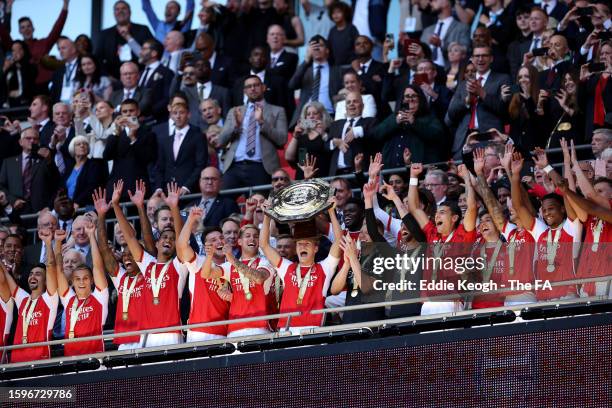Martin Odegaard of Arsenal lifts the FA Community Shield Trophy following the team's victory after a penalty shootout during The FA Community Shield...