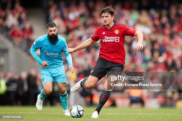 Harry Maguire of Manchester United competes for the ball with Asier Villalibre of Athletic Club during the pre-season friendly match between...