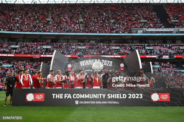 Martin Odegaard of Arsenal lifts the FA Community Shield following The FA Community Shield match between Manchester City against Arsenal at Wembley...