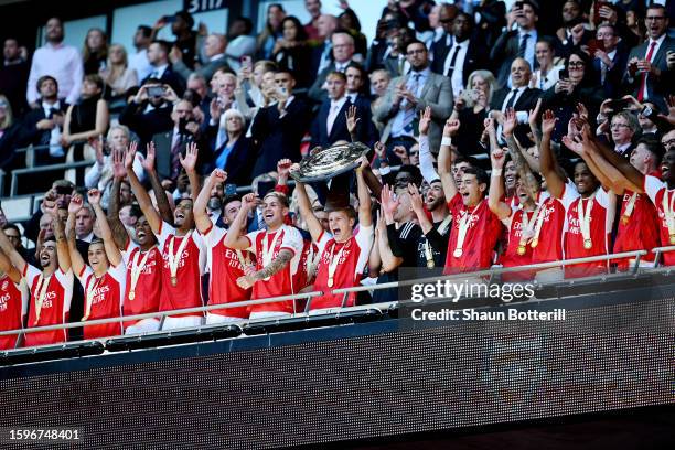 Martin Odegaard of Arsenal lifts the FA Community Shield Trophy following the team's victory after the penalty shootout during The FA Community...