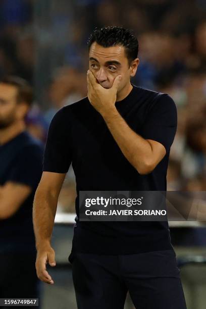 Barcelona's Spanish coach Xavi gestures on the sidelines during the Spanish Liga football match between Getafe CF and FC Barcelona at the Col....