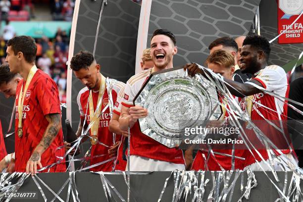 Declan Rice of Arsenal holds the FA Community Shield following The FA Community Shield match between Manchester City against Arsenal at Wembley...