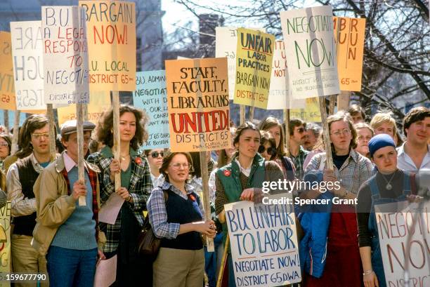 View of Boston University employees strikers with demand signs, Boston, Massachusetts, 1979.