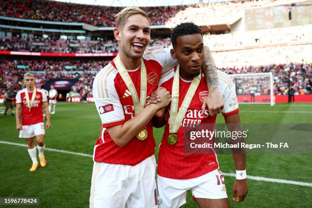 Emile Smith Rowe and Jurrien Timber of Arsenal celebrate with their FA Community Shield medals following the team's victory in the penalty shootout...