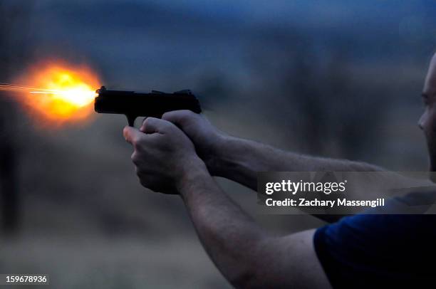 Friend shooting a 9mm Ruger semi automatic handgun