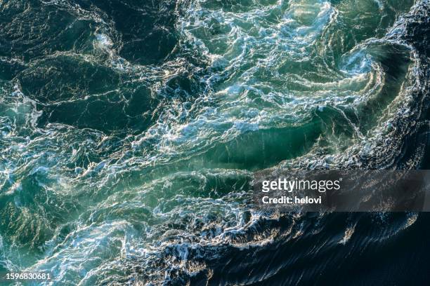 tidal whirlpool at fjord saltfjorden in bodo territory - tides stock pictures, royalty-free photos & images
