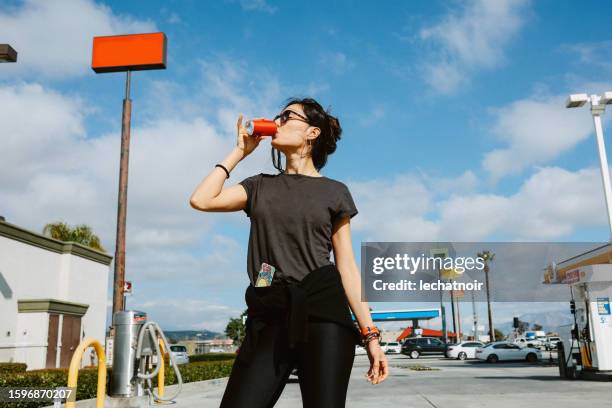 roadtrip break at the gas station somewhere in california - soda bottle imagens e fotografias de stock