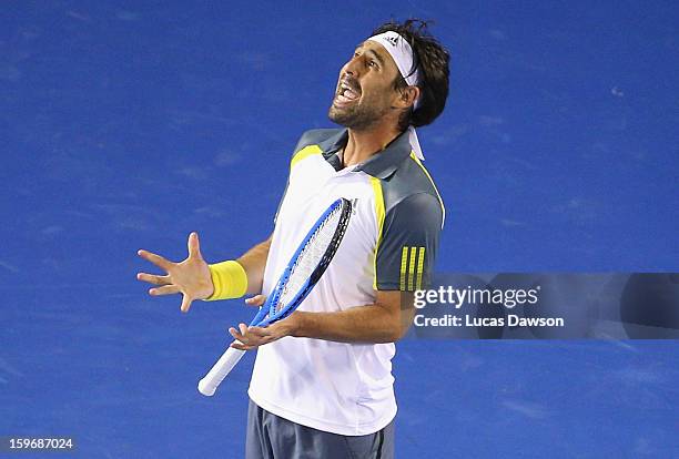 Marcos Baghdatis of Cyprus reacts during his third round match against David Ferrer of Spain during day five of the 2013 Australian Open at Melbourne...