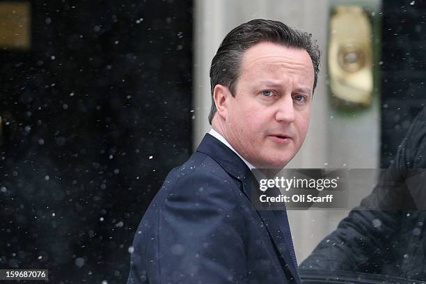 British Prime Minister David Cameron leaves Number 10 Downing Street to travel to the House of Commons to deliver a statement on the unfolding...