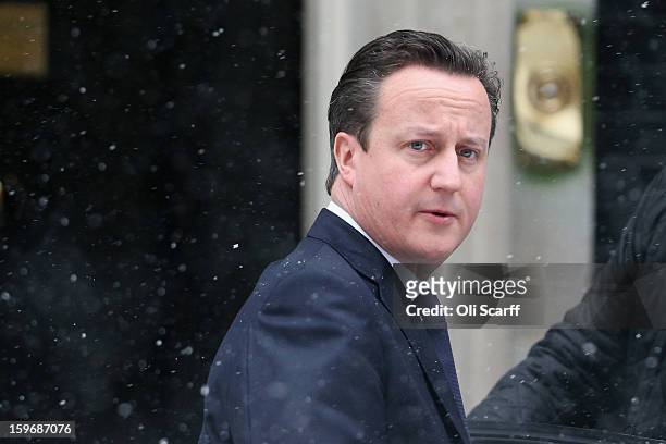 British Prime Minister David Cameron leaves Number 10 Downing Street to travel to the House of Commons to deliver a statement on the unfolding...