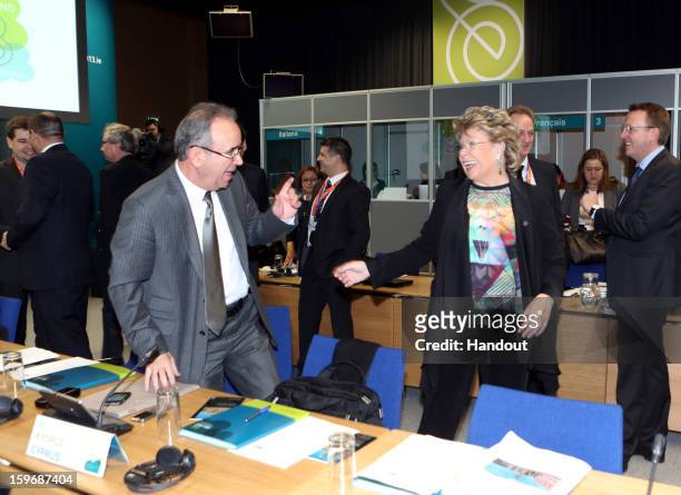 In this handout image provided by Justin MacInnes, Viviane Reding, Vice President of the European Commission talks with Loucas Louca, Minister for...