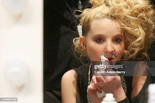 Model backstage at Sebastian Ellrich Autumn/Winter 2013/14 fashion show during Mercedes-Benz Fashion Week Berlin at Brandenburg Gate on January 18,...