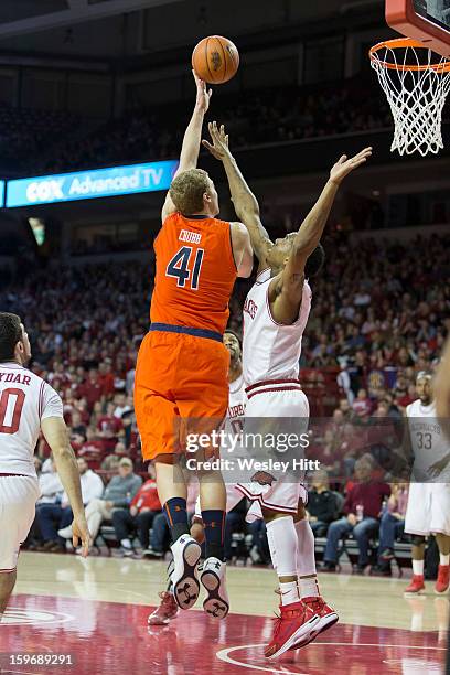 Rob Chubb of the Auburn Tigers shots a hook shot over Coty Clarke of the Arkansas Razorbacks at Bud Walton Arena on January 16, 2013 in Fayetteville,...