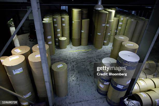 Rolls of newsprint paper stand in a storeroom before use at the Kathimerini printing plant in Paiania, Greece, on Thursday, Jan. 17, 2013. An...