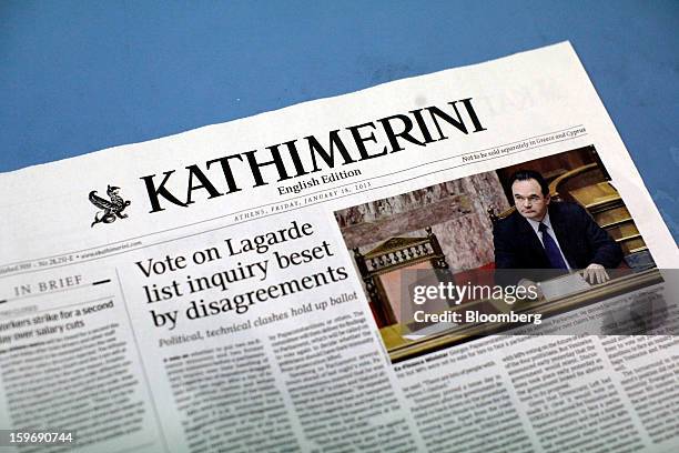 Story about George Papaconstantinou, Greece's former finance minister, is seen on a page of Kathimerini newspaper's English language edition at the...