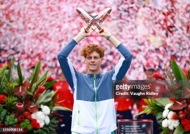 Jannik Sinner of Italy lifts the champions trophy after his win against Alex De Minaur of Australia in the Singles Final during Day Seven of the...