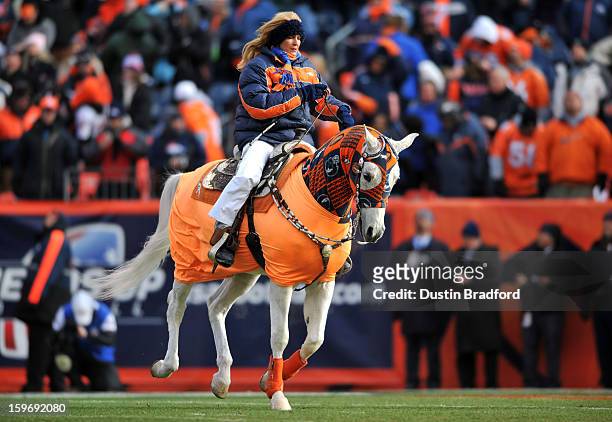 Ann Judge Wegener rides Thunder as the Denver Broncos take the field to face the Baltimore Ravens during the AFC Divisional Playoff Game at Sports...
