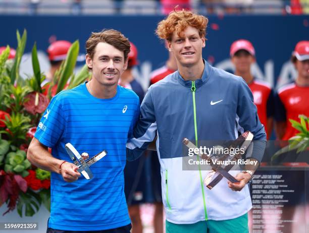 Jannik Sinner of Italy and Alex De Minaur of Australia pose with their trophies after the Singles Final during Day Seven of the National Bank Open,...