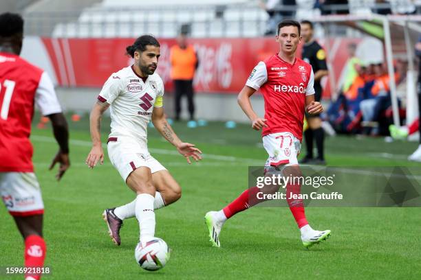 Alexis Flips of Reims, left Ricardo Rodriguez of Torino in action during the friendly match between Stade de Reims and Torino FC at Stade Auguste...