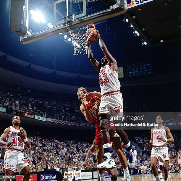 Glen Rice of the Miami Heat goes for a dunk against the Atlanta Hawks during game three, round one of the 1994 NBA Playoffs in Miami, Florida. NOTE...