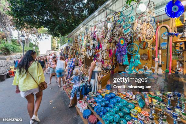 tourists roaming the street in the historic city. august 1, 2016 old town, rhodes island, greece - rhodes old town stock pictures, royalty-free photos & images