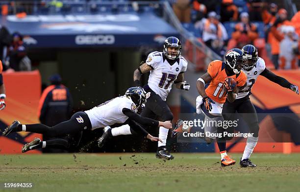 Trindon Holliday of the Denver Broncos returns a kickoff 104 yards for a touchdown in the third quarter against Justin Tucker of the Baltimore Ravens...