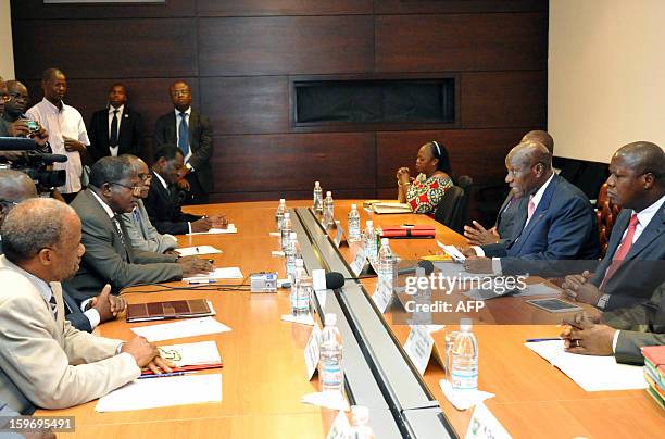 Prime Minister of Ivory Coast Daniel Kablan Duncan speaks to leaders of ex-president Laurent Gbagbo's Ivorian Popular Front party, FPI's interim...