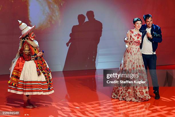 Tino Sehgal grabs the microphone from moderator Meret Becker after receiving the B.Z. Kulturpreis on January 18, 2013 in Berlin, Germany.