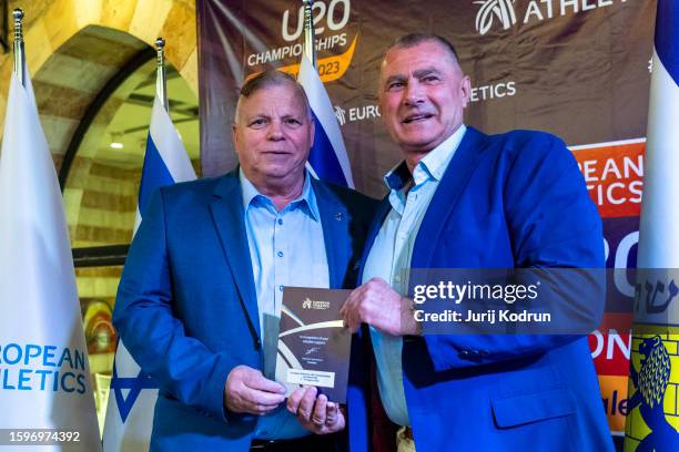 Deputy mayor of Jerusalem Elisha Peleg of Israel, and President of European Athletics Dobromir Karamarinov of Bulgaria pose with plaques during LOC...