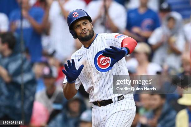 Jeimer Candelario of the Chicago Cubs reacts after an RBI single in the fifth inning against the Atlanta Braves at Wrigley Field on August 06, 2023...