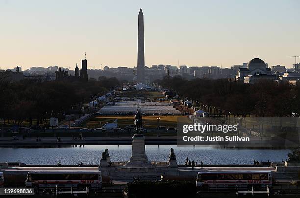 Tour buses and tourists are seen near the U.S. Capitol on January 18, 2013 in Washington, DC. The U.S. Capital is preparing for the second...