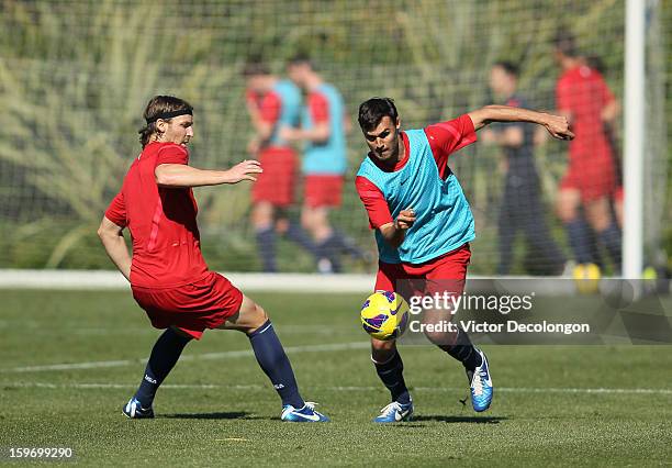 Jeff Parke and Chris Wondolowski vie for the ball during the U.S. Men's Soccer Team training session at the Home Depot Center on January 17, 2013 in...