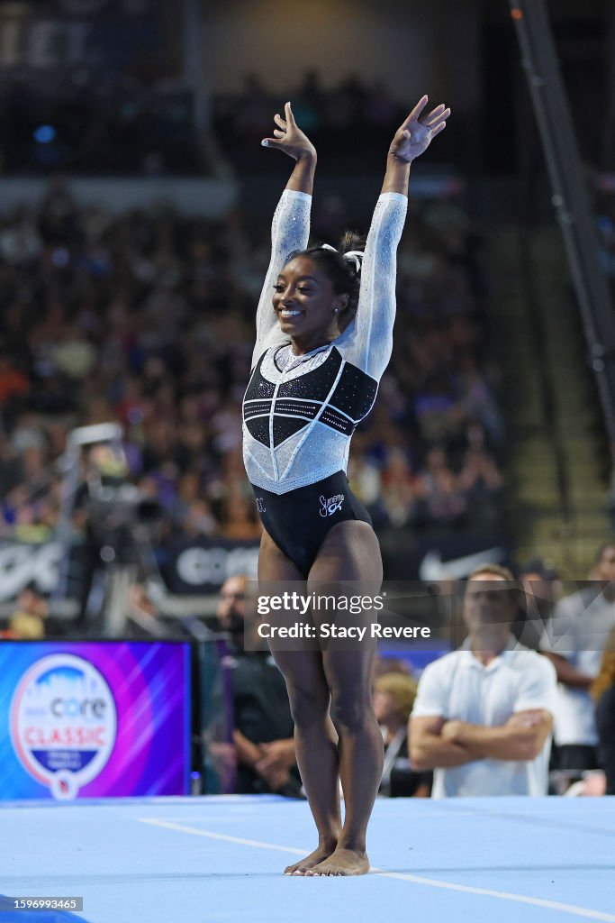 Simone Core Simone Biles competes in the floor exercise during the Core Hydration ...