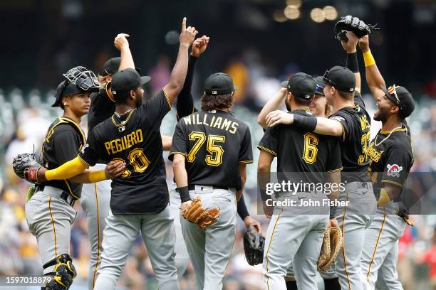 Pittsburgh Pirates players congratulate each other after a 4-1 victory over the Milwaukee Brewers at American Family Field on August 06, 2023 in...