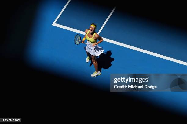 Maria Kirilenko of Russia celebrates match point in her third round match against Yanina Wickmayer of Belarus during day six of the 2013 Australian...