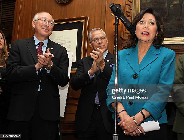 Secretary Of The Interior Ken Salazar and Rep. Ruben Hinojosa look on as Secretary of Labor Hilda Solis makes a few remarks at a reception to...
