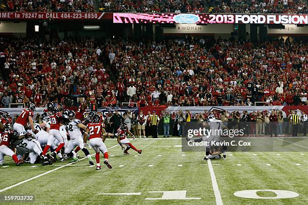 Ryan Longwell of the Seattle Seahawks kicks an extra point against the Atlanta Falcons during the NFC Divisional Playoff Game at Georgia Dome on...