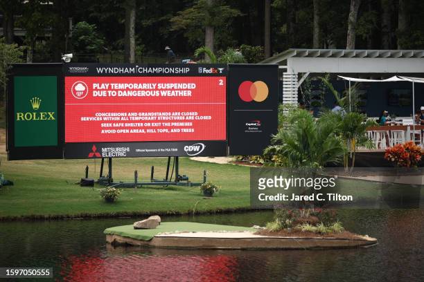 General view of a scoreboard showing that play has been suspended due to dangerous weather during the final round of the Wyndham Championship at...