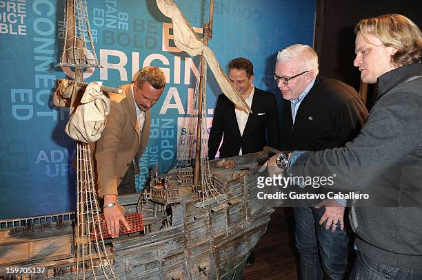 Michael Haussman, Christopher Gallo, Stephan Talty and Fritz Hanselmann observe a replica of Henry Morgan's flagship, The Satisfaction, following an...