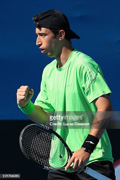 Nikola Milojevic of Serbia celebrates in his first round match against Jurence Zosimo Mendoza of Philippines during the 2013 Australian Open Junior...