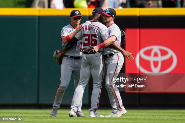 Alex Call, Stone Garrett and Lane Thomas of the Washington Nationals celebrate following a 6-3 win against the Cincinnati Reds at Great American Ball...