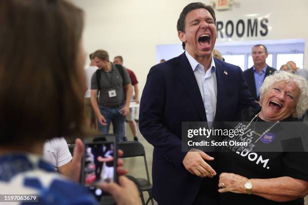 Republican presidential candidate Florida Governor Ron DeSantis greets guests at Ashley's BBQ Bash hosted by Congresswoman Ashley Hinson on August...