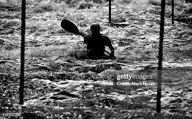 Competitor in the Men's Kayak negotiates the gates during day four of the Australian Youth Olympic Festival at the Penrith White Water Stadium on...