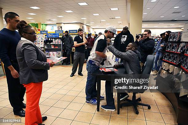 Cent promotes the new book "Formula 50: A 6-Week Workout and Nutrition Plan That Will Transform Your Life" at Barnes & Noble on January 18, 2013 in...