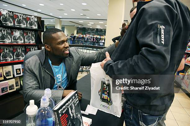 Cent promotes the new book "Formula 50: A 6-Week Workout and Nutrition Plan That Will Transform Your Life" at Barnes & Noble on January 18, 2013 in...