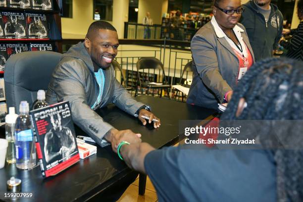 Cent promotes the new book "Formula 50: A 6-Week Workout and Nutrition Plan That Will Transform Your Life" at Barnes & Noble on January 18, 2013 in...